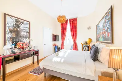 a bedroom with a bed and a desk and a window at Private Garden 3-Bed in Cannes in Cannes