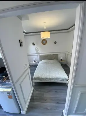 a small bedroom with a bed in a room at Smart 2 Apart - Le 62 Cannes in Cannes
