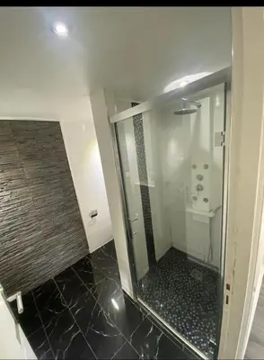 a bathroom with a shower with a toilet and a sink at Smart 2 Apart - Le 62 Cannes in Cannes