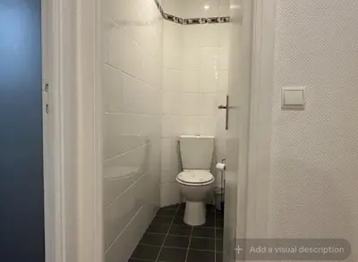 a bathroom with a white toilet in a stall at Croisette Top Floor 2BR with Bay View Balcony in Cannes