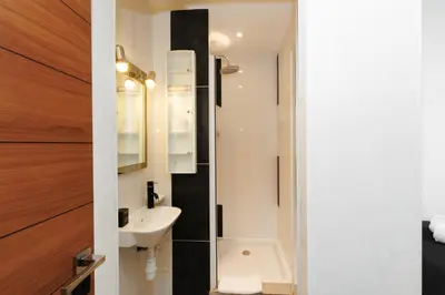a bathroom with a sink and a mirror at Palais Prestige YourHostHelper in Cannes
