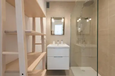 a bathroom with a shower and a sink and a toilet at 2-Br Apartment with Terrace Near Cannes Centre in Cannes