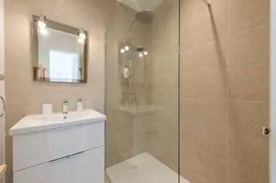 a bathroom with a shower and a sink at 2-Br Apartment with Terrace Near Cannes Centre in Cannes