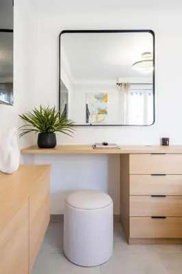 a dressing table with a mirror and a stool at L'HARMONIE DE CARNOT avec Balcon in Cannes