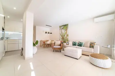 a living room with a couch and chairs and a table at KEM15 Appartement avec vue mer in Cannes