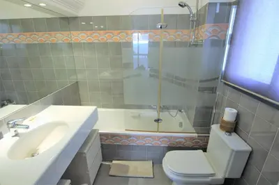 a bathroom with a sink and a toilet and a shower at air-conditionned apartment 2 bedrooms & bathrooms with refined decoration in Cannes