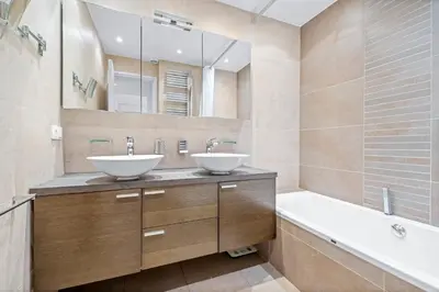 a bathroom with two sinks and a tub and a bathtubermott at REF 2052 - Seasonal rental - Prestigious apartment on the Croisette Cannes in Cannes
