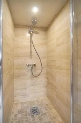 a bathroom with a shower with wooden walls at Cannes hyper centre -palais du festival -croisette -quartier historique du suquet in Cannes