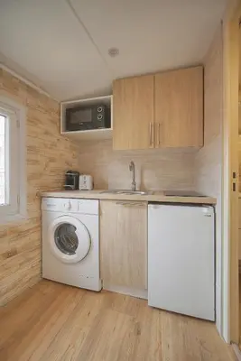 a kitchen with a washing machine and a sink at Cannes hyper centre -palais du festival -croisette -quartier historique du suquet in Cannes