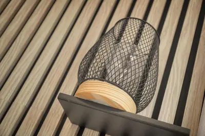 a black wire basket with a book in it at Cannes hyper centre -palais du festival -croisette -quartier historique du suquet in Cannes