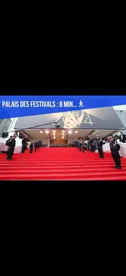 a red carpeted floor with a sign that reads palaussresres festivals at Cannes hyper centre -palais du festival -croisette -quartier historique du suquet in Cannes
