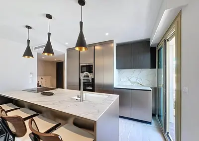 a kitchen with a large island in the middle at New Modern rooftop 2 ch 4 peoples Clim Wifi in Le Cannet