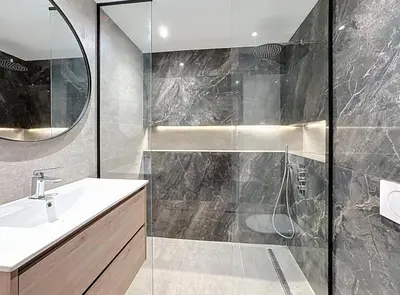 a bathroom with a shower and a sink and a mirror at New Modern rooftop 2 ch 4 peoples Clim Wifi in Le Cannet