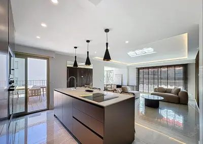 a kitchen with a large island in a living room at New Modern rooftop 2 ch 4 peoples Clim Wifi in Le Cannet