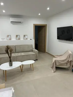 a living room with a couch and a table at Joyaux cannois in Cannes