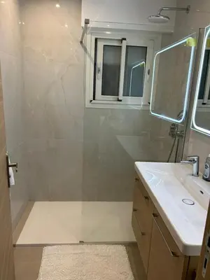 a bathroom with a shower and a sink at Joyaux cannois in Cannes