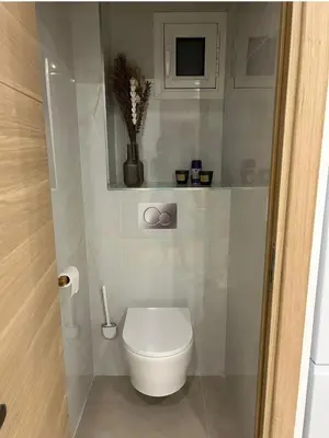 a bathroom with a white toilet in a room at Joyaux cannois in Cannes