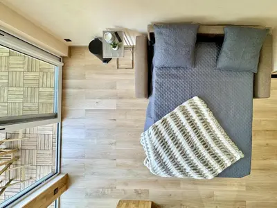 a small bed in a tiny house at Top floor apartment in Cannes