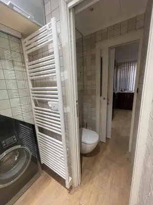 a bathroom with a toilet and a sink at Suquet apartment cosy et charming in Cannes