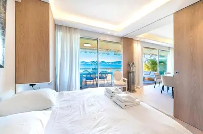 a bedroom with a large bed with purple sheets at Mon Croisettee in Cannes