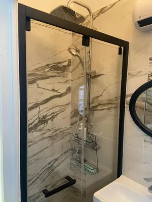 a shower with a glass door in a bathroom at Studio climatisé 5 min centre Cannes in Cannes
