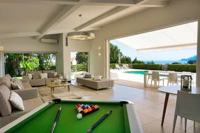 a living room with a pool table at Ref JOA - Palmes d Or Properties in Cannes