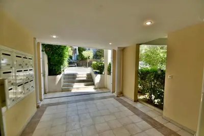 an empty hallway of a house with a hallway at Studio BELLA VISTA avec parking in Le Cannet