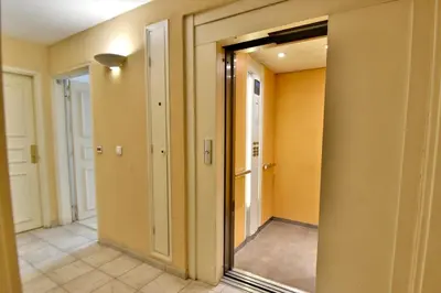 a hallway with a mirror in a room at Studio BELLA VISTA avec parking in Le Cannet
