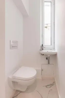 a white bathroom with a toilet and a sink at 2 chambres-BALCON-VUE MER-FELIX FAURE A2B231 in Cannes