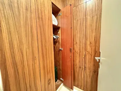 a wooden closet with a wooden door in a room at Gray studio D vue mer in Cannes