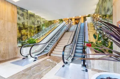 an empty escalator in a building with stairs at Gray studio D vue mer in Cannes