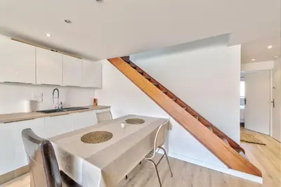 a kitchen and dining room with a table at DUPLEX 2 chambres -TERRASSE Vue MER-FELIX FAURE A2B024 in Cannes