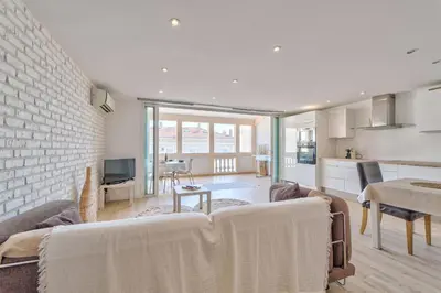 a living room with a couch and a dining room at DUPLEX 2 chambres -TERRASSE Vue MER-FELIX FAURE A2B024 in Cannes