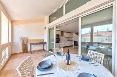 a dining room with a table and chairs at DUPLEX 2 chambres -TERRASSE Vue MER-FELIX FAURE A2B024 in Cannes