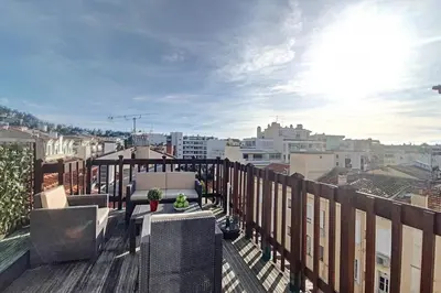 a balcony with a view of a city with buildings at HENRI CAMILLE REAL ESTATE - ROOF - 2 bedrooms downtown w rooftop in Cannes