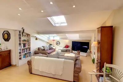 a living room with a couch and a table at HENRI CAMILLE REAL ESTATE - ROOF - 2 bedrooms downtown w rooftop in Cannes