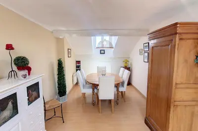 a dining room with a table and white chairs at HENRI CAMILLE REAL ESTATE - ROOF - 2 bedrooms downtown w rooftop in Cannes