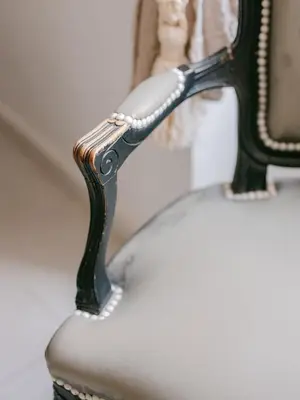 a close up of a arm of a chair at Le Petit Palais, 100m des plages in Cannes