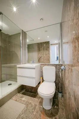 a bathroom with a toilet and a sink and a tub at Le Petit Palais, 100m des plages in Cannes