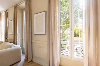 a room with a window and a bed and a windowvisor at Modern AC apartment - 2BDR 4P - Cannes Beach in Cannes