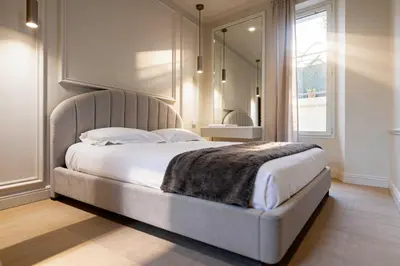 a bedroom with a large bed with a large mirror at Modern AC apartment - 2BDR 4P - Cannes Beach in Cannes