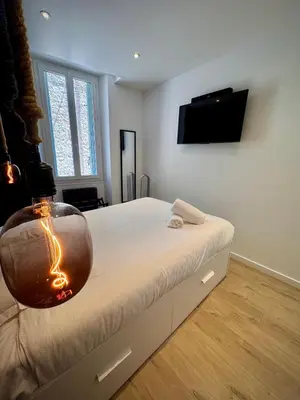 a bedroom with a bed with a bowl on it at Très Bel appartement proche plage et palais du festival in Cannes
