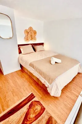 a laptop computer sitting on a wooden table in a room at Loft suite Cannes Near Palais de festivals in Cannes