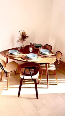 a dining room table with chairs and plates on it at Loft suite Cannes Near Palais de festivals in Cannes