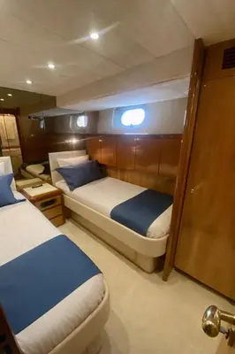 a man taking a picture of a bathroom with a toilet and sink at Yacht FALCON FIVE in Cannes