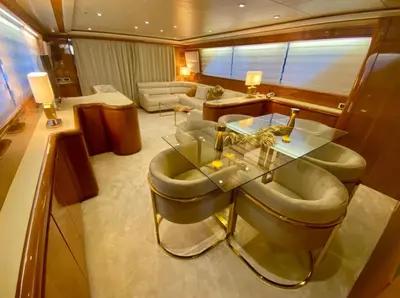 a living room with a glass table and chairs at Yacht FALCON FIVE in Cannes