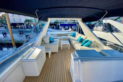 a dining area on a boat with a table and chairs at Yacht FALCON FIVE in Cannes