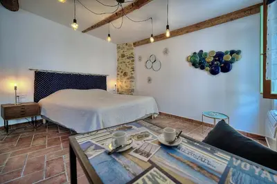 a bedroom with a bed and a table in a room at Agréable Studio quartier Suquet-Vieux Port A0B185 in Cannes