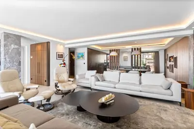 a living room with white furniture and a table at REF 2043 - Cannes Penthouse with panoramic sea view for rent in Cannes