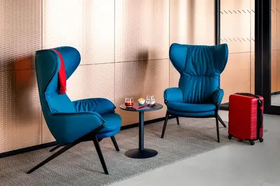 two blue chairs and a table with glasses on it at OKKO Hotels Cannes Centre in Cannes
